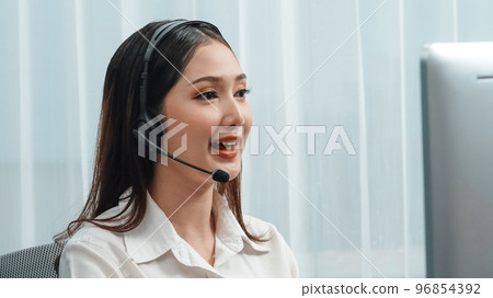 Enthusiastic female operator provide helpful customer service to customer. Enthusiastic female operator provide helpful customer service to customer. 96854392