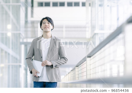Young businessman walking in the office 96854436