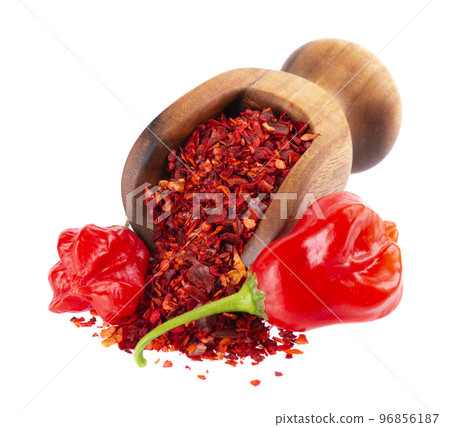 Fresh and dry ground red chili peppers isolated on white background. Capsicum baccatum or Bishop's crown pepper. 96856187