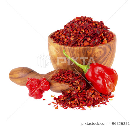 Fresh and dry ground red chili peppers isolated on white background. Capsicum baccatum or Bishop's crown pepper. 96856221