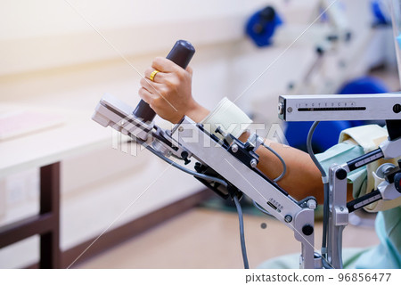 woman wear machine arm for physical therapy. By defining how a robot driven moving technique can be improved to achieve better results in physical rehabilitation woman wear machine arm for physical therapy. By defining how a robot driven moving technique can be improved to achieve better results in physical rehabilitation 96856477