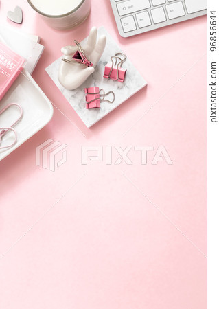 A feminine workspace, keyboard of a computer on pink background with copy space A feminine workspace, keyboard of a computer on pink background with copy space 96856644