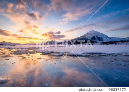 North, Norway. Winter landscape during sunset. Bright sky. Ice and snow on the shore. 96857275