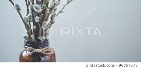 Banner. Part of a willow bouquet in a brown glass vase. The concept of a happy Easter with a copy space. Palm Sunday. High quality photo 96857578