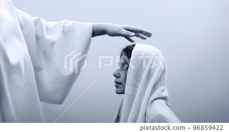 Blessing hand above the head of a woman in a headscarf Blessing hand above the head of a woman in a headscarf 96859422