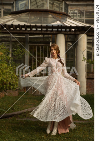 A young beautiful bride in a long boho wedding dress. 96859574