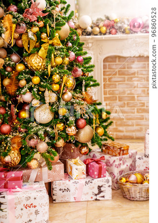 boxes with gifts on the Christmas tree with classic decorations. boxes with gifts on the Christmas tree with classic decorations. 96860528