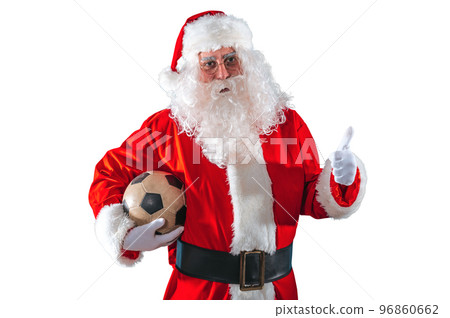 Positive santa claus with football ball in hand Positive santa claus with football ball in hand 96860662