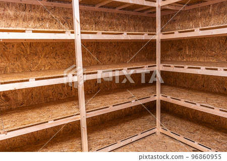 OSB racks, shelves are designed for storing things. Dressing room in the house. Organization of spaces in the house. Shelves in the garage. OSB racks, shelves are designed for storing things. Dressing room in the house. Organization of spaces in the house. Shelves in the garage. 96860955
