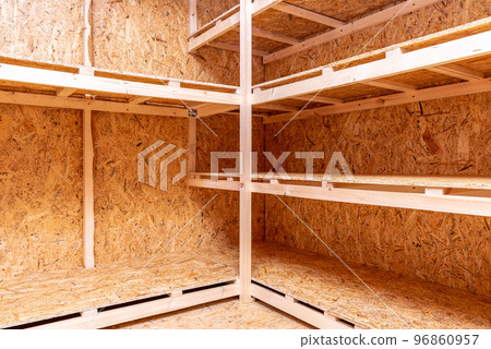 OSB racks, shelves are designed for storing things. Dressing room in the house. Organization of spaces in the house. Shelves in the garage. OSB racks, shelves are designed for storing things. Dressing room in the house. Organization of spaces in the house. Shelves in the garage. 96860957