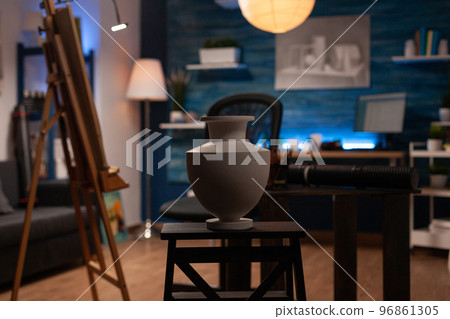 Empty art creation studio. Drawing artist workspace filled with creative tools. Clear workshop with implements for artistic creation of drawings with color pencils on canvas. 96861305