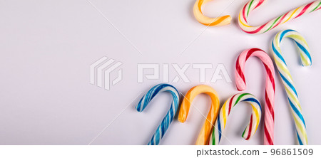 Christmas composition, candy canes on a white background. Horizontal banner 96861509