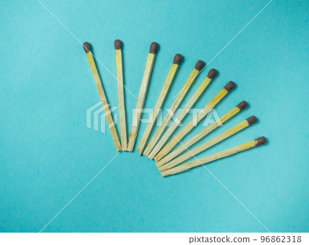Matches on a blue background. Fire-starting products 96862318