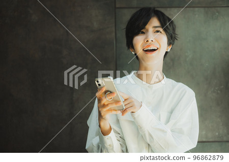 A woman by the window A woman by the window 96862879