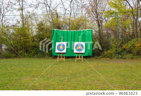 Two archery targets set on a sports field 96863823