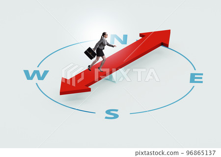 Businesswoman with compass looking for direction Businesswoman with compass looking for direction 96865137