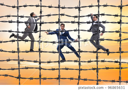 Businessman in barbed wire concept 96865631