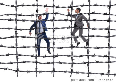 Businessman in barbed wire concept 96865632