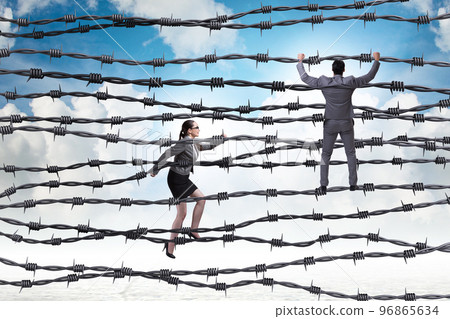 Business people in barbed wire concept Business people in barbed wire concept 96865634