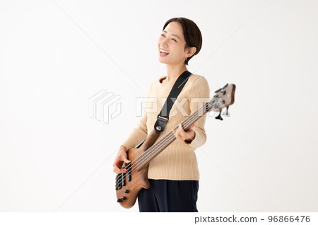 Woman playing bass White background 96866476
