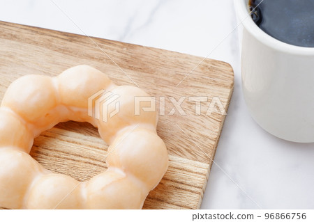 sugar coated ring donuts and coffee 96866756