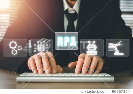 RPA Robotic Process Automation Innovation technology concept, Person typing keyboard computer with VR screen RPA icon on office desk. 96867394