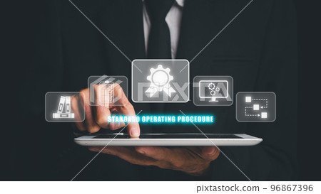 SOP, Standard Operating Procedure concept, Businessman hand touching digital tablet with SOP icon on virtual screen. 96867396