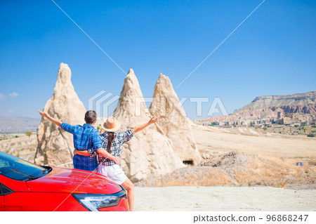 Family on car vacation. Happy couple travel by car in mountains.  96868247