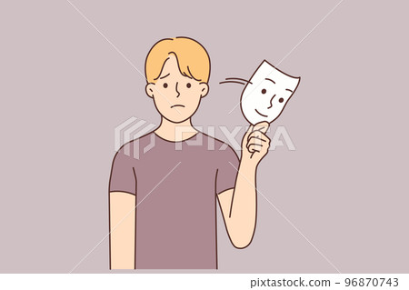 Unhappy man take off smiling mask  96870743