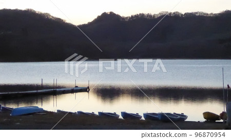 Sunset and boats on the lake Sunset and boats on the lake 96870954