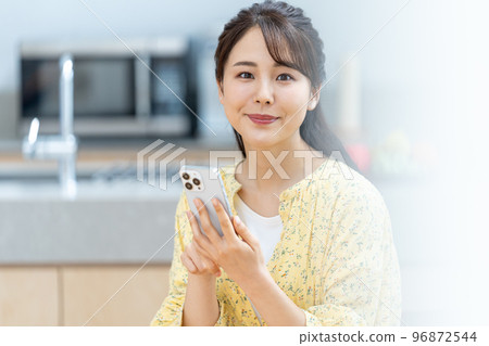 A young lady with a smartphone A young lady with a smartphone 96872544
