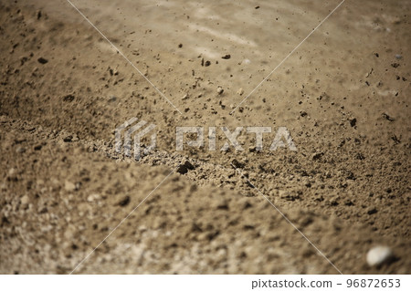 Dirt rolled up by an off-road bike Dirt rolled up by an off-road bike 96872653