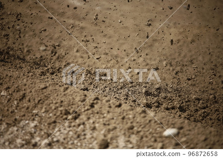 Dirt rolled up by an off-road bike Dirt rolled up by an off-road bike 96872658