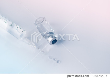 Glass vial and syringe with injection. Vaccination or beauty therapy concept. 96873594