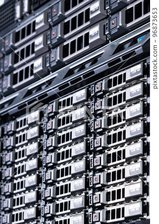Row of hard drives serving as data storage inside server room 96873653