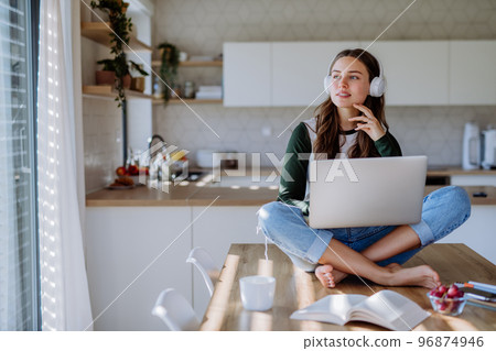 Young woman having homeoffice in her apartment. 96874946