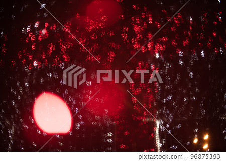 Red bokeh on a dark background 96875393