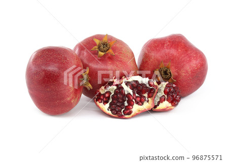 Fresh ripe pomegranate fruits isolated on white Fresh ripe pomegranate fruits isolated on white 96875571