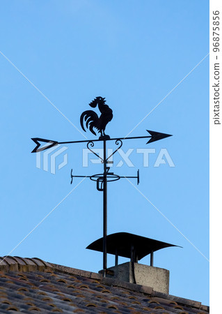 There is a nice weathercock on the roof There is a nice weathercock on the roof 96875856