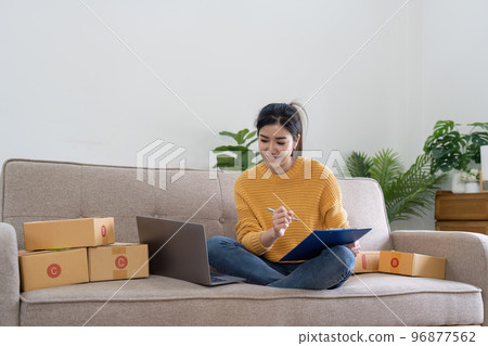 Startup small business entrepreneur online SME or freelance woman working at home concept, Young Asian small business owner at home office, online marketing packaging and delivery, SME concept Startup small business entrepreneur online SME or freelance woman working at home concept, Young Asian small business owner at home office, online marketing packaging and delivery, SME concept 96877562