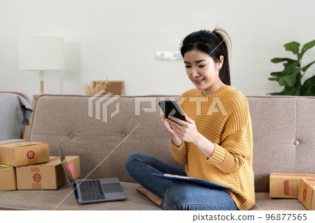 Startup small business entrepreneur online SME or freelance woman working at home concept, Young Asian small business owner at home office, online marketing packaging and delivery, SME concept Startup small business entrepreneur online SME or freelance woman working at home concept, Young Asian small business owner at home office, online marketing packaging and delivery, SME concept 96877565