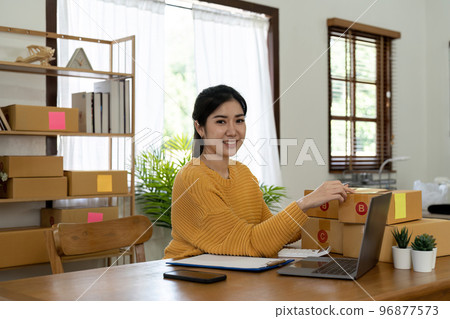 Startup small business entrepreneur online SME or freelance woman working at home concept, Young Asian small business owner at home office, online marketing packaging and delivery, SME concept 96877573
