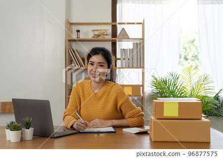 Startup small business entrepreneur online SME or freelance woman working at home concept, Young Asian small business owner at home office, online marketing packaging and delivery, SME concept 96877575