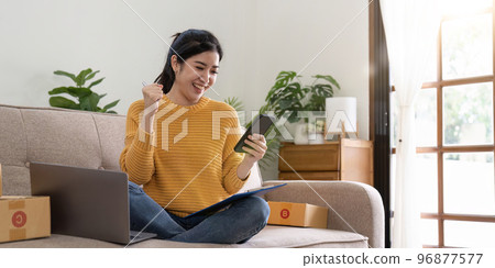 Startup small business entrepreneur online SME or freelance woman working at home concept, Young Asian small business owner at home office, online marketing packaging and delivery, SME concept Startup small business entrepreneur online SME or freelance woman working at home concept, Young Asian small business owner at home office, online marketing packaging and delivery, SME concept 96877577