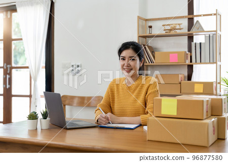 Startup small business entrepreneur online SME or freelance woman working at home concept, Young Asian small business owner at home office, online marketing packaging and delivery, SME concept Startup small business entrepreneur online SME or freelance woman working at home concept, Young Asian small business owner at home office, online marketing packaging and delivery, SME concept 96877580