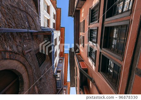 Renaissance building of 19th century, narrow sky strip, Plovdiv, Bulgaria 96878330