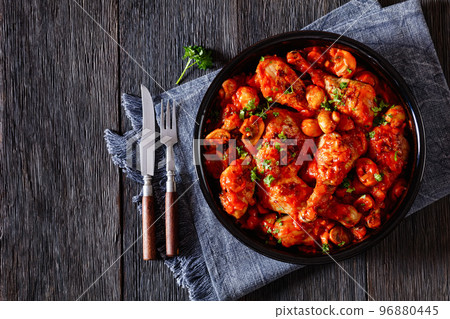 chicken stew with mushrooms in a tomato sauce 96880445