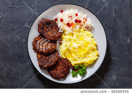 fried minced liver patties with potato mash fried minced liver patties with potato mash 96880456