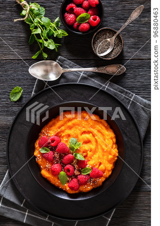 Sweet Potato Mash topped with fresh Raspberries Sweet Potato Mash topped with fresh Raspberries 96880463