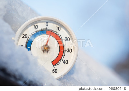 Outdoor thermometer shows high temperature warm winter weather concept Outdoor thermometer shows high temperature warm winter weather concept 96880648